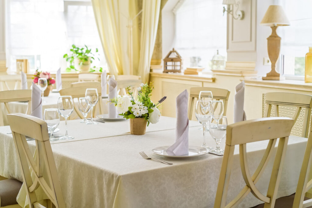 Elegant served table with wine glasses in modern restaurant
